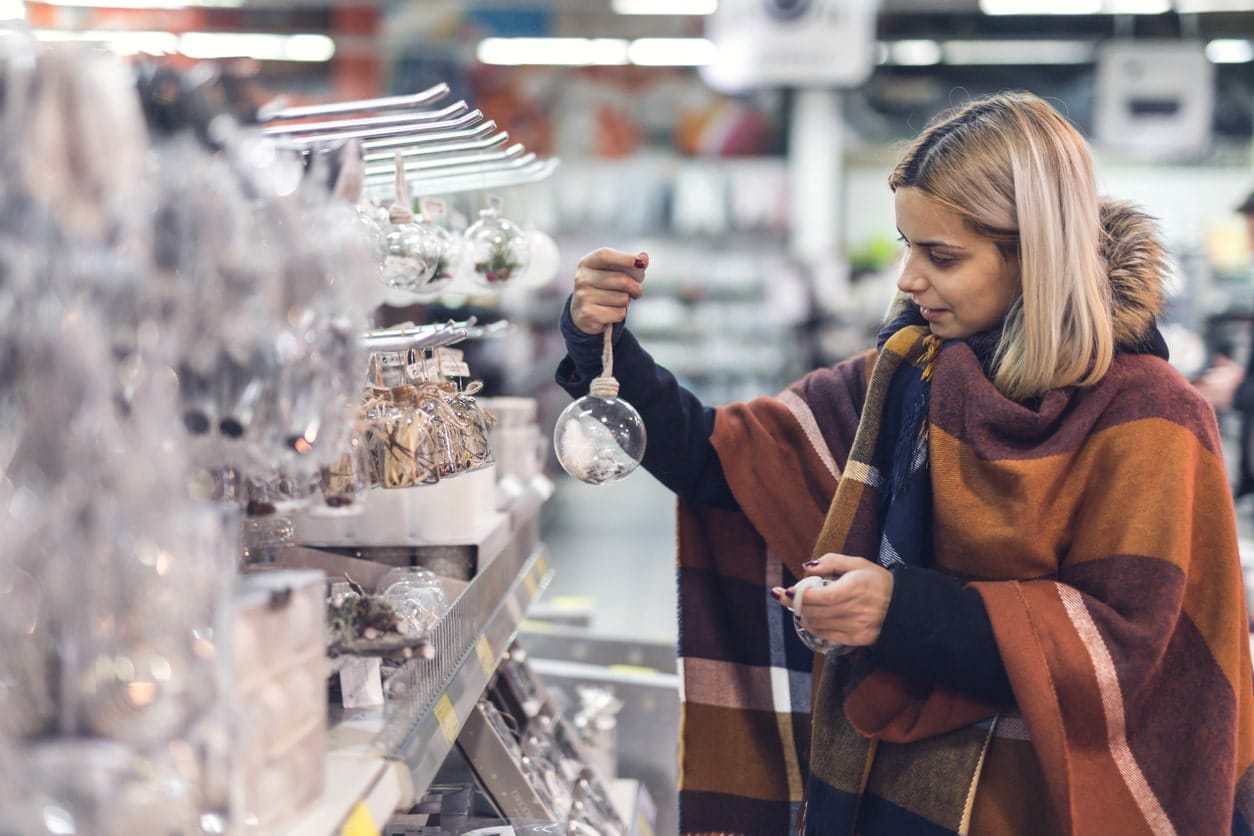woman shopping during festive period in beautifully cleaned retail space